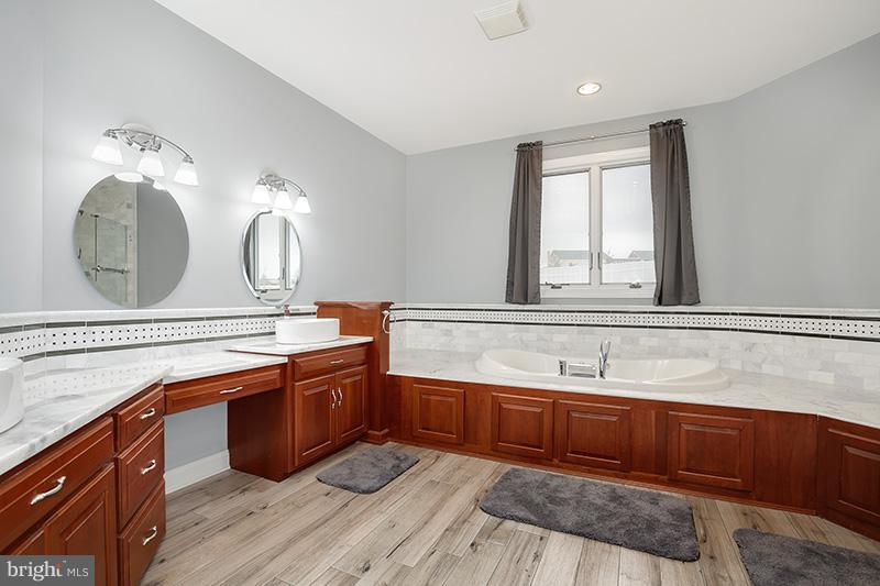 4320 Valley View Road Middletown, MD 21769 - Photo 18 of 30 a view of double vanity sink a mirror and a window