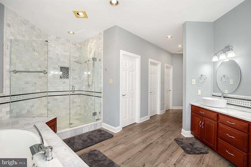 4320 Valley View Road Middletown, MD 21769 - Photo 19 of 30 a bathroom with a double vanity sink mirror and shower