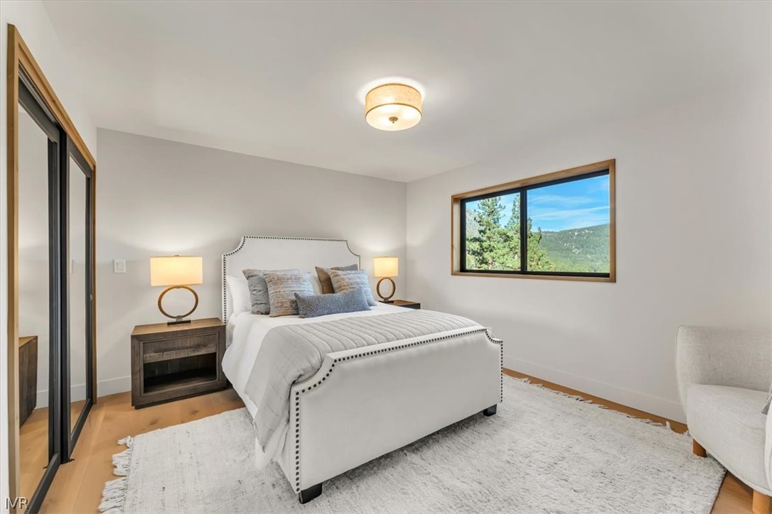 877 Tyner Way Incline Village, NV 89451 - Photo 25 of 43 a bedroom with a bed and a lamp