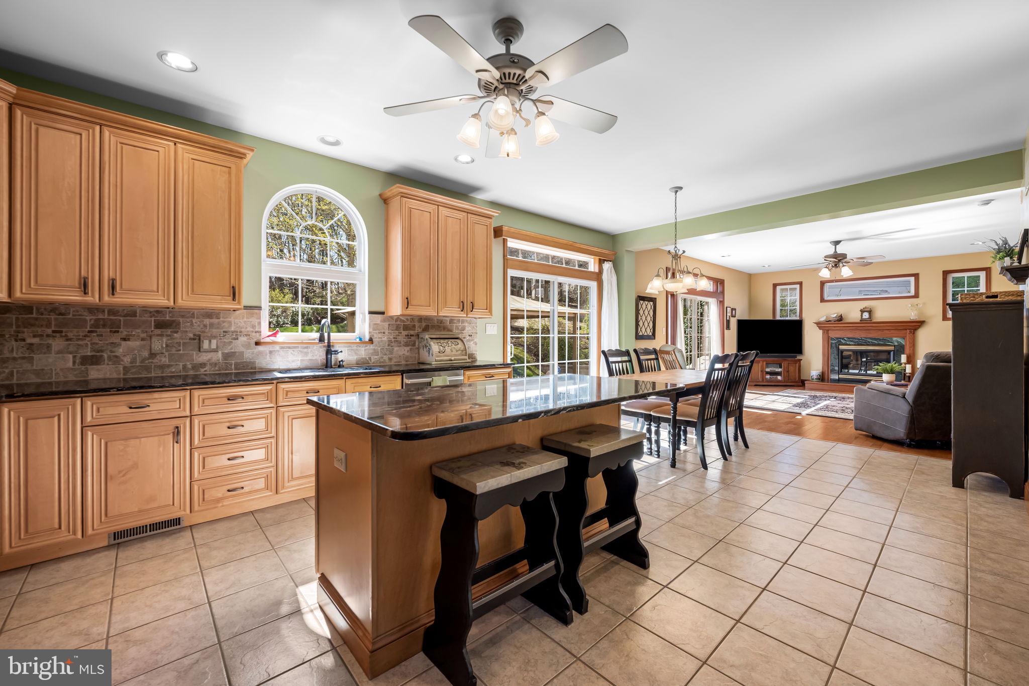 6815 Cherry Tree Court New Market, MD 21774 - Photo 19 of 86 a kitchen with stainless steel appliances granite countertop sink stove and cabinets