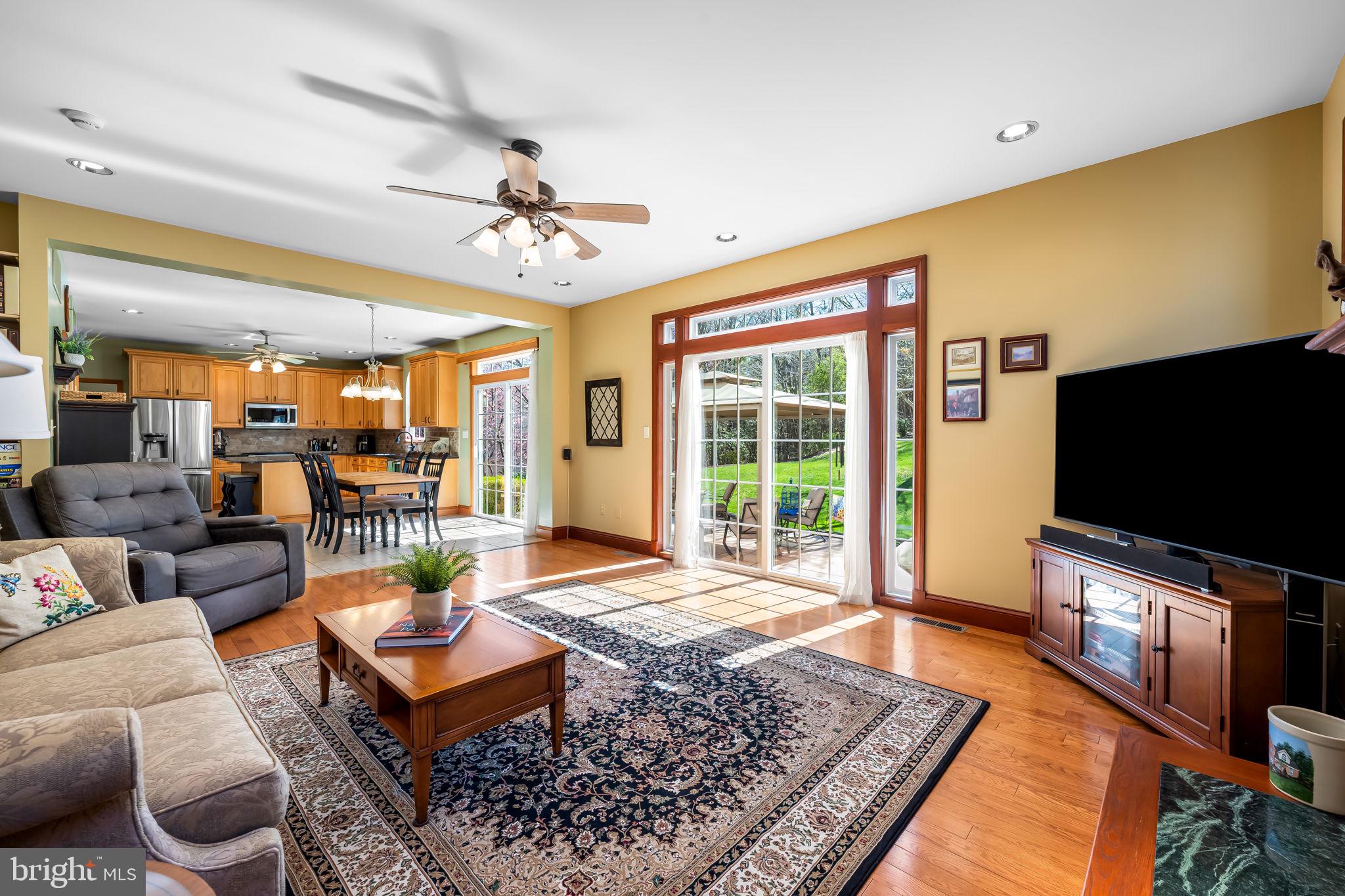 6815 Cherry Tree Court New Market, MD 21774 - Photo 23 of 86 a living room with furniture and a flat screen tv