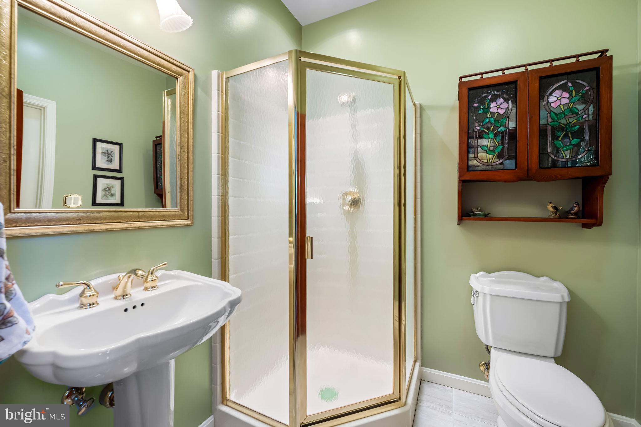 6815 Cherry Tree Court New Market, MD 21774 - Photo 25 of 86 a bathroom with a sink mirror and toilet
