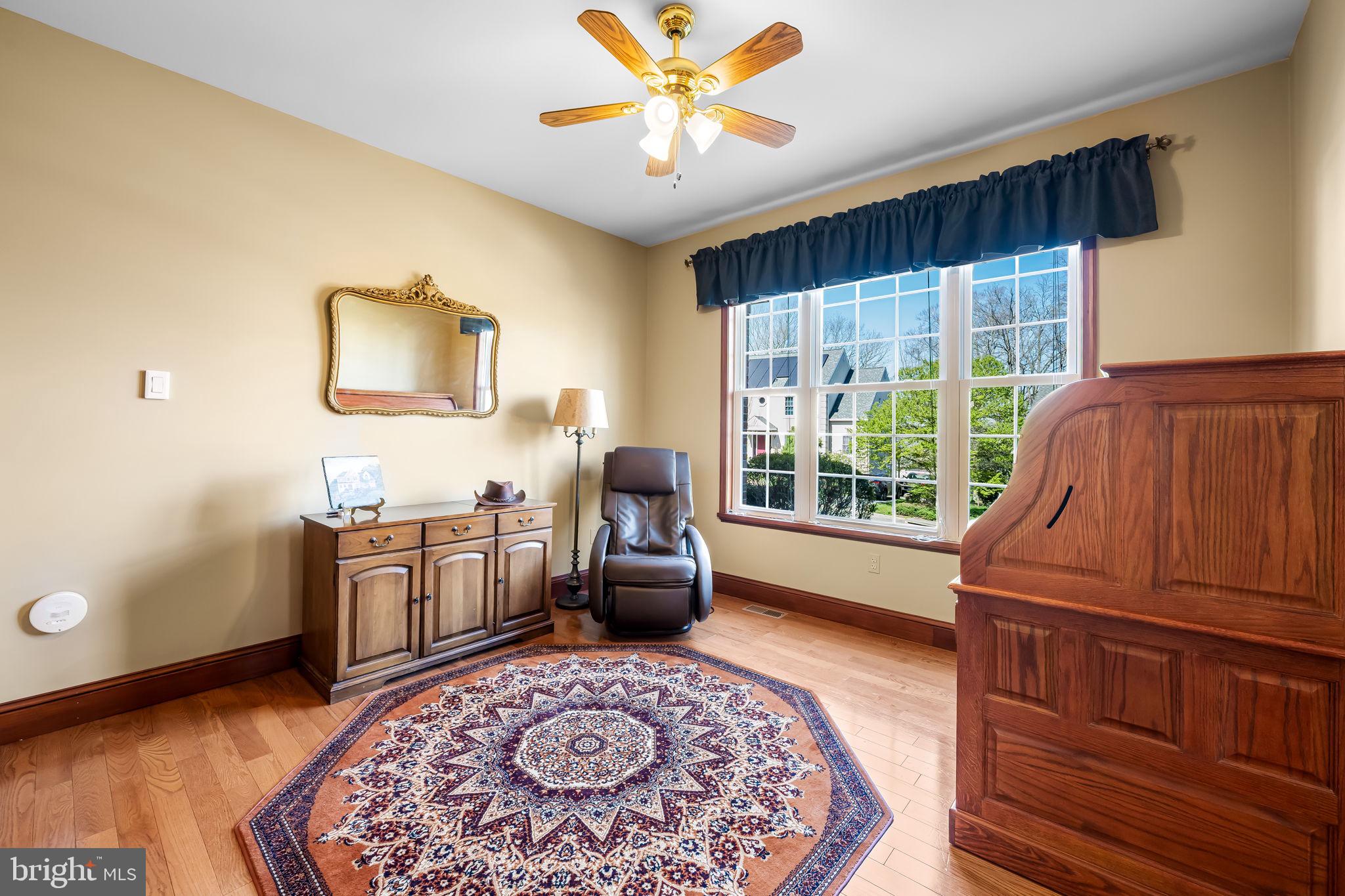 6815 Cherry Tree Court New Market, MD 21774 - Photo 26 of 86 a living room with furniture and a large window