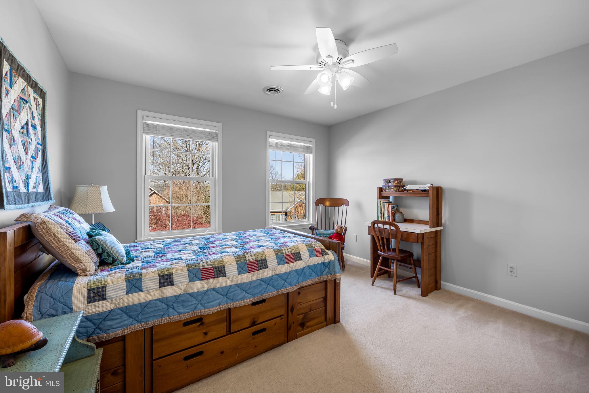 6815 Cherry Tree Court New Market, MD 21774 - Photo 31 of 86 a bed room with furniture and a chandelier