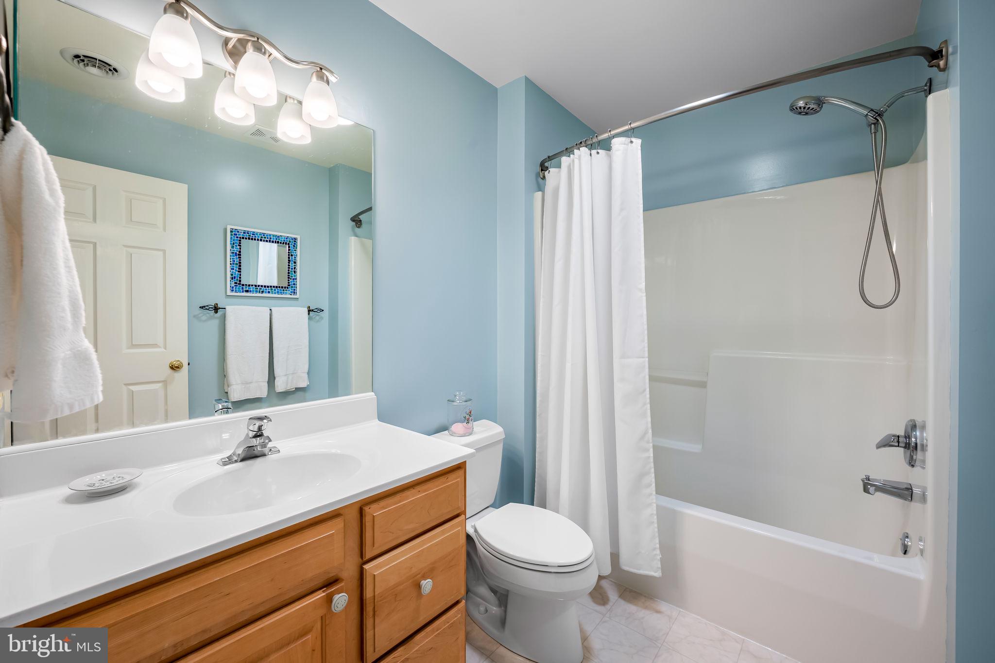 6815 Cherry Tree Court New Market, MD 21774 - Photo 32 of 86 a bathroom with a granite countertop sink toilet and shower