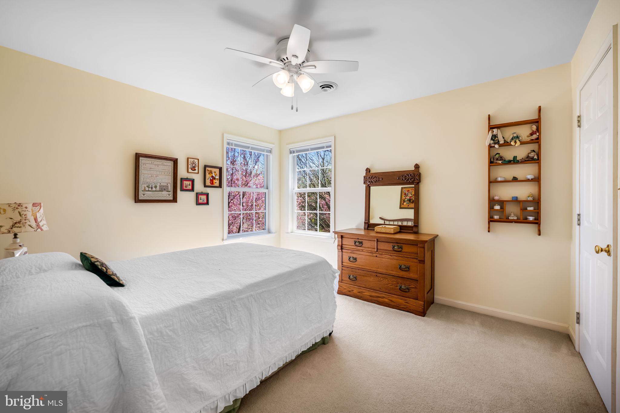 6815 Cherry Tree Court New Market, MD 21774 - Photo 34 of 86 a bedroom with a bed and a dresser