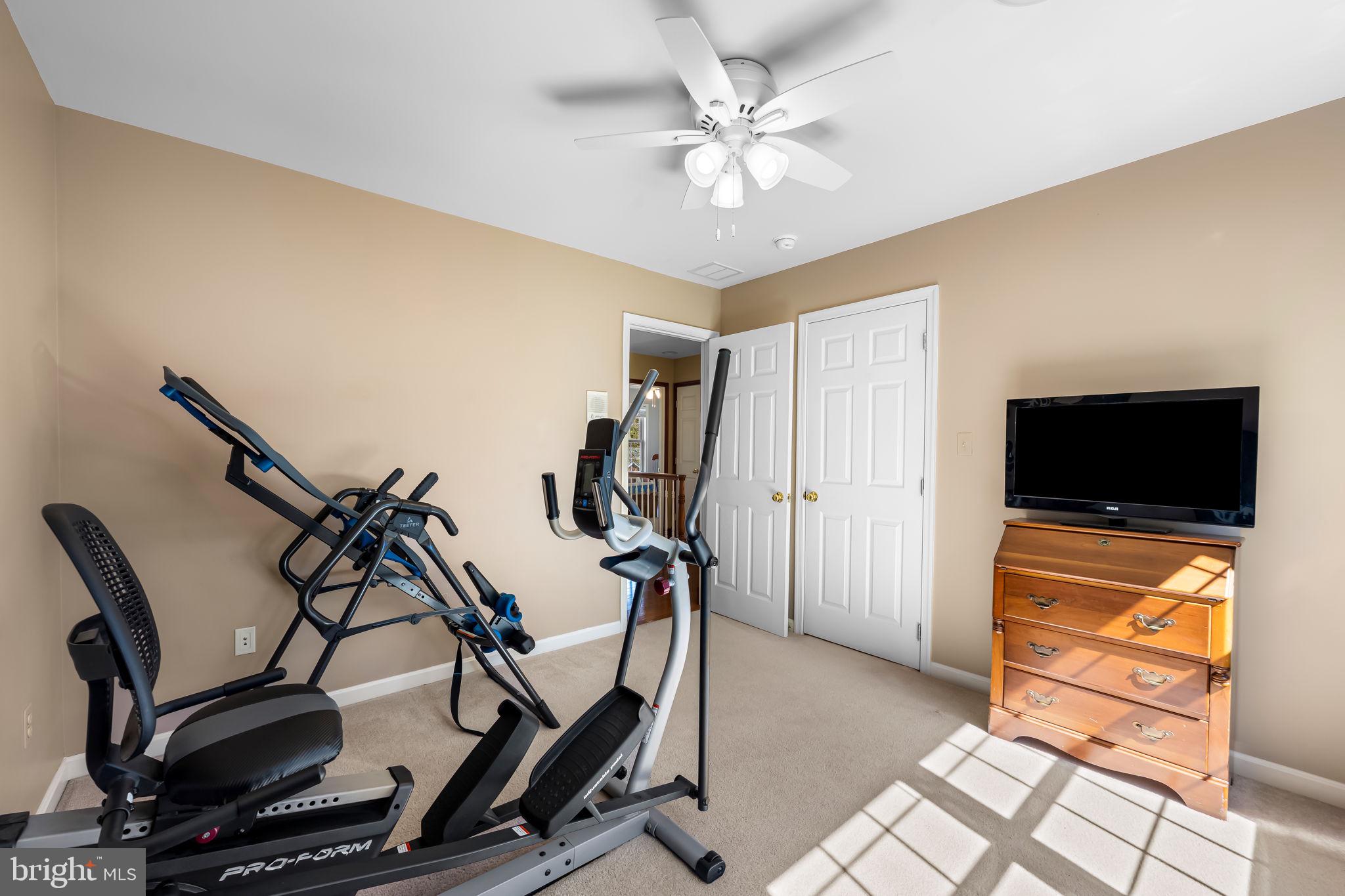 6815 Cherry Tree Court New Market, MD 21774 - Photo 36 of 86 a view of a livingroom with furniture and a flat screen tv