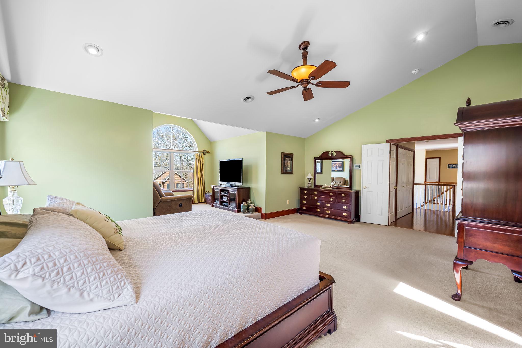 6815 Cherry Tree Court New Market, MD 21774 - Photo 44 of 86 a bedroom with a bed gym equipment and a large window