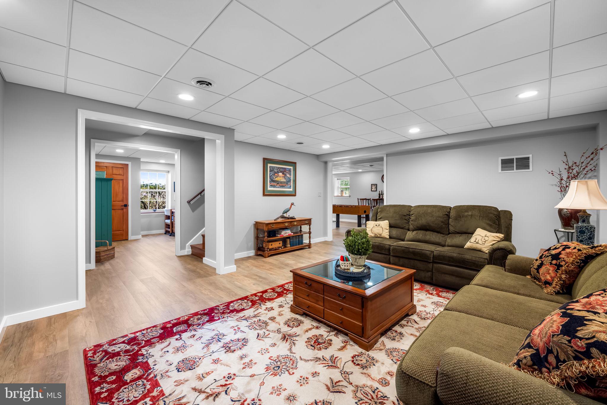 6815 Cherry Tree Court New Market, MD 21774 - Photo 52 of 86 a living room with furniture rug and wooden floor