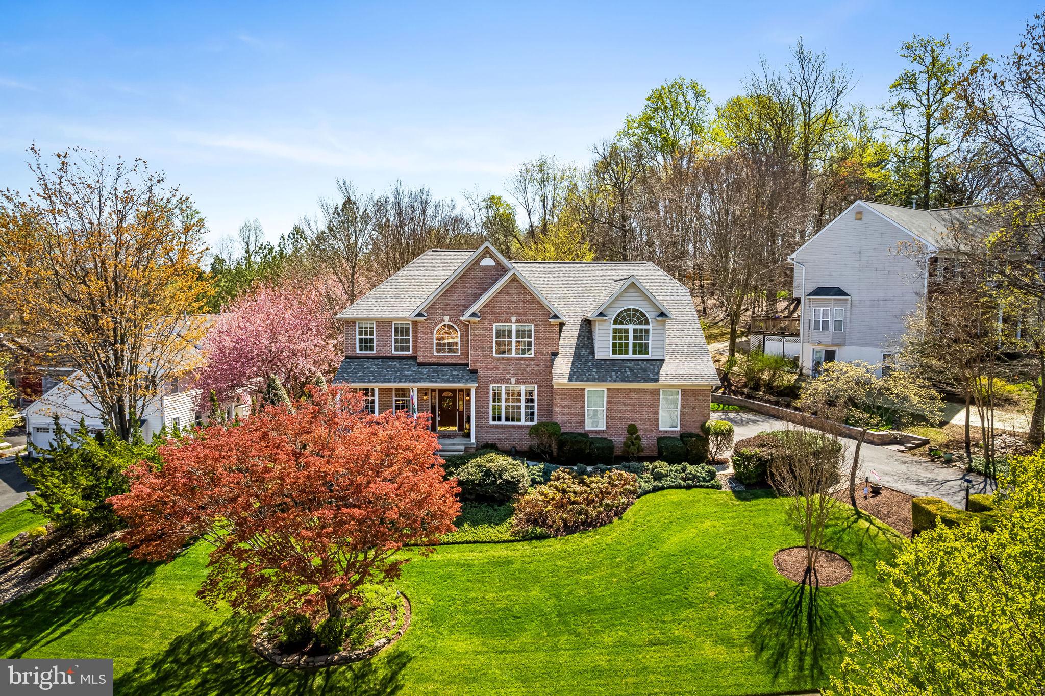 6815 Cherry Tree Court New Market, MD 21774 - Photo 71 of 86 a front view of a house with a yard and trees
