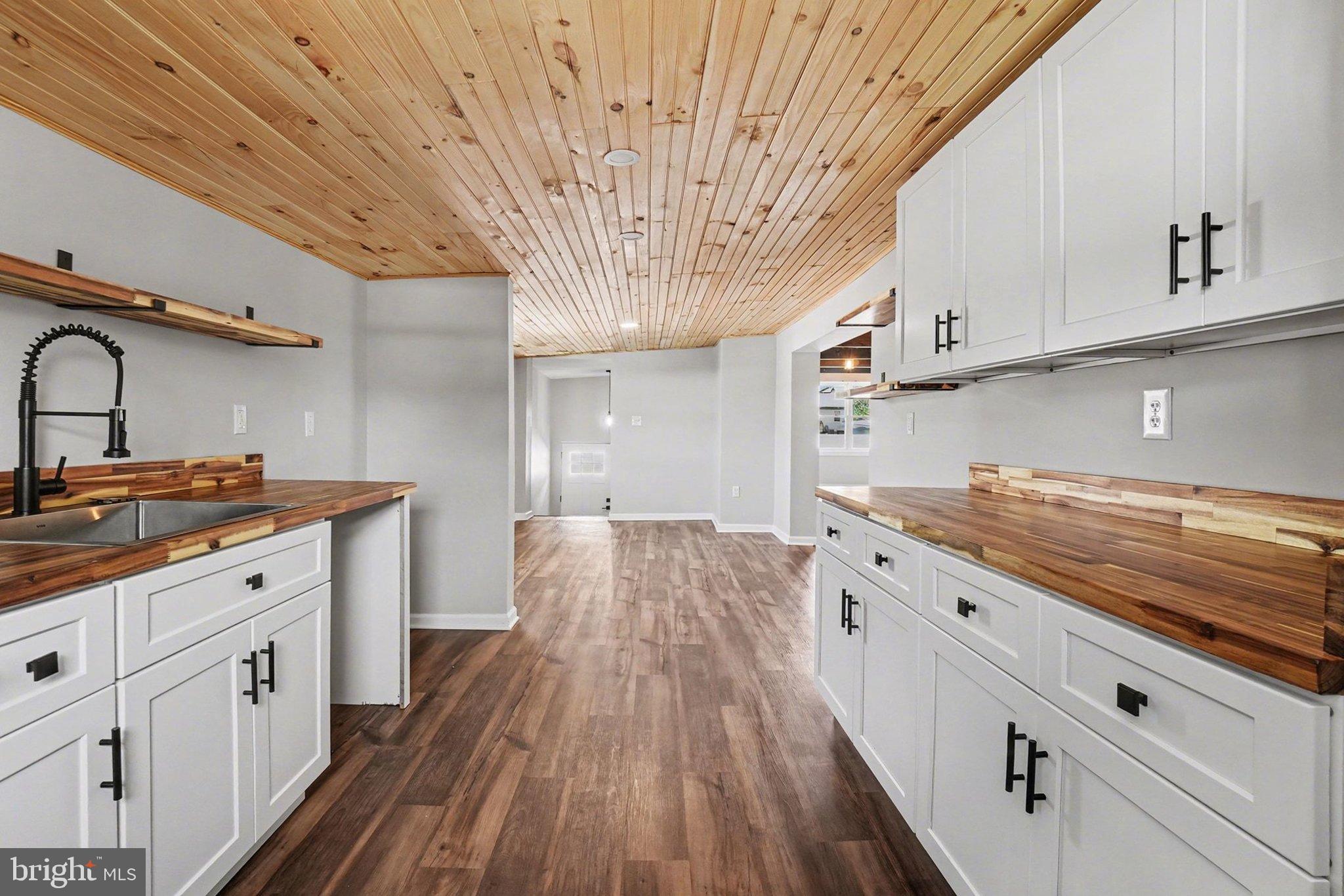 7 Groy Avenue Lebanon, PA 17046 - Photo 13 of 33 a large kitchen with cabinets wooden floor and stainless steel appliances