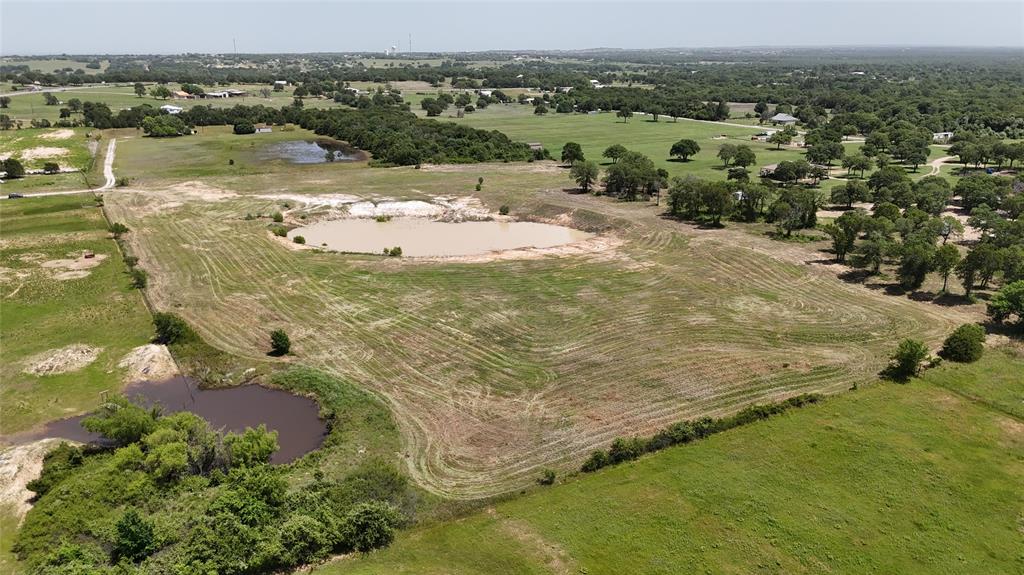 8605 West Highway 199, Unit C Springtown, TX 76082 - Photo 1 of 23 a view of a lake with a mountain