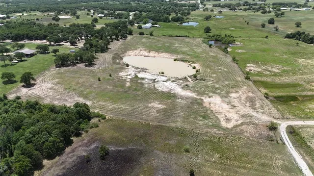 a view of a water pond with green space