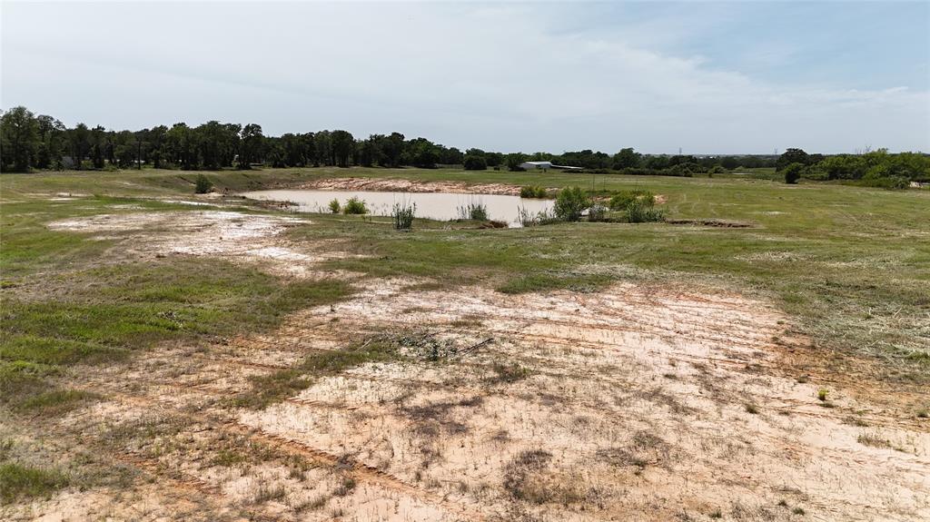8605 West Highway 199, Unit C Springtown, TX 76082 - Photo 19 of 23 a view of a lake with houses in the back