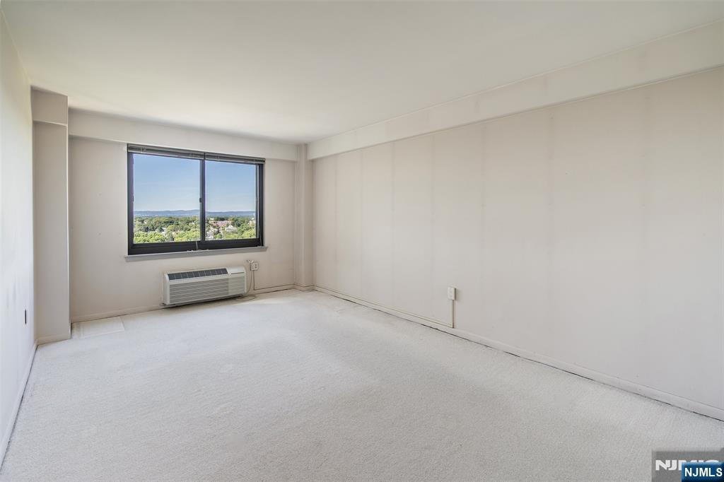 307 Prospect Avenue, Unit 14D Hackensack, NJ 07601 - Photo 15 of 18 a view of an empty room with a window