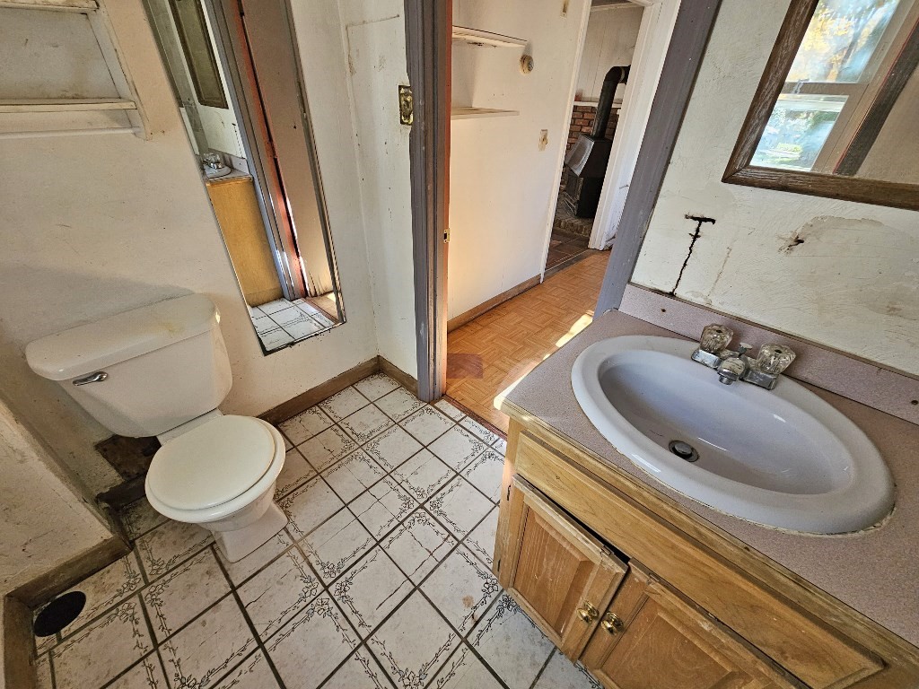 94 Clark Road Spencer, MA 01562 - Photo 11 of 17 a bathroom with a sink toilet and mirror