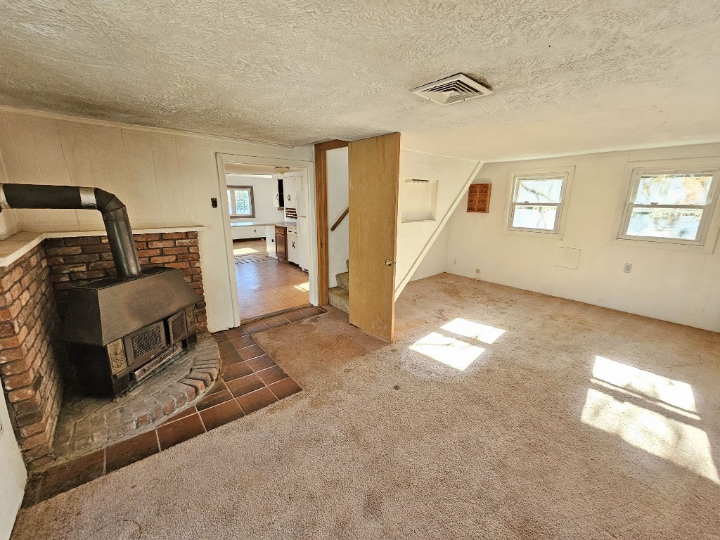 94 Clark Road Spencer, MA 01562 - Photo 13 of 17 a view of a livingroom with furniture and a ceiling fan