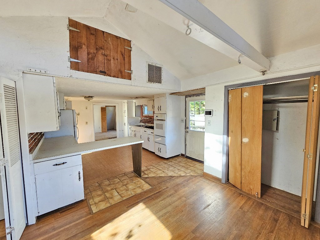 94 Clark Road Spencer, MA 01562 - Photo 6 of 17 a kitchen with granite countertop a refrigerator and a sink