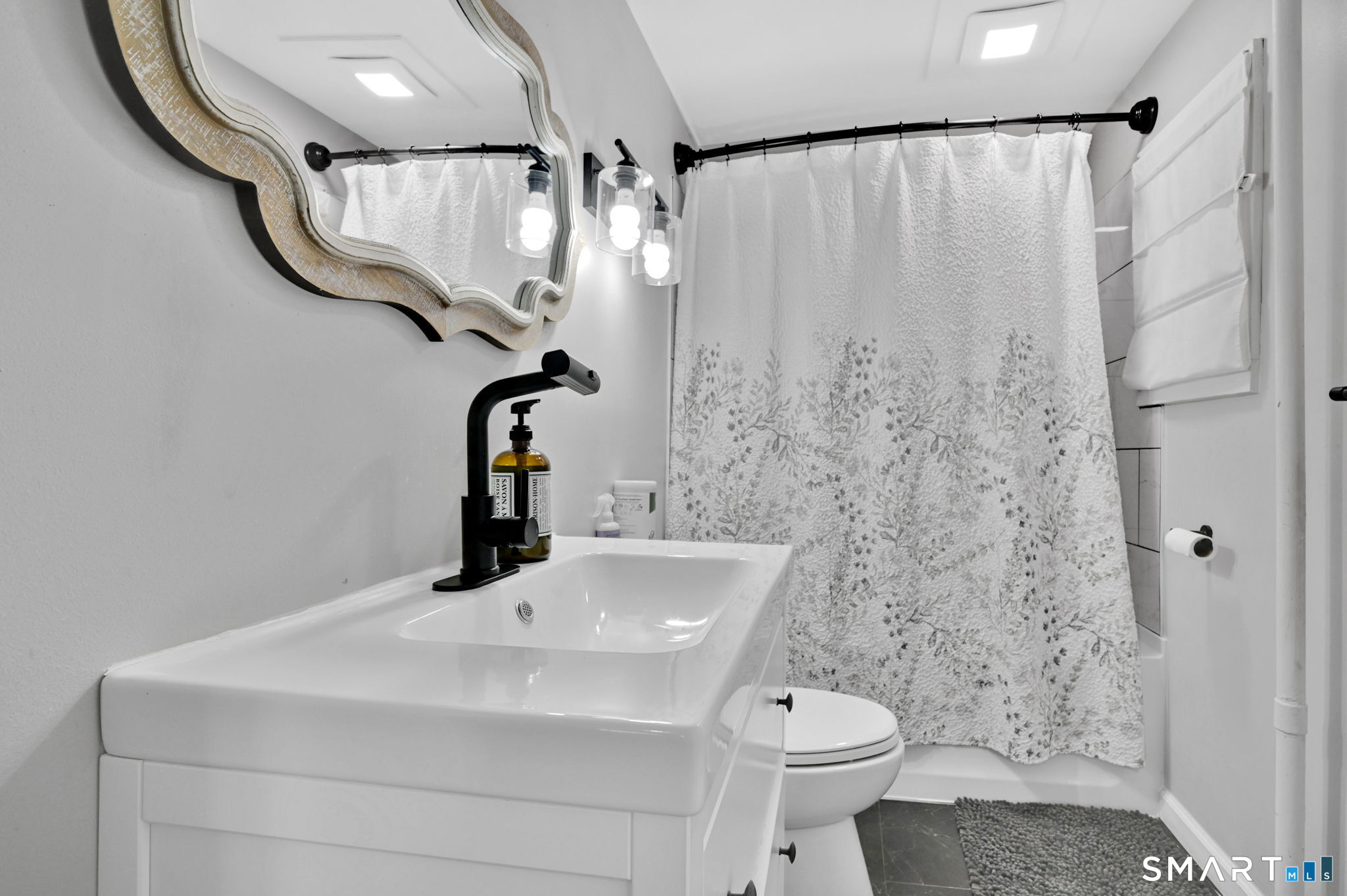 124 Prospect Street Vernon, CT 06066 - Photo 12 of 31 a bathroom with a sink a toilet and shower