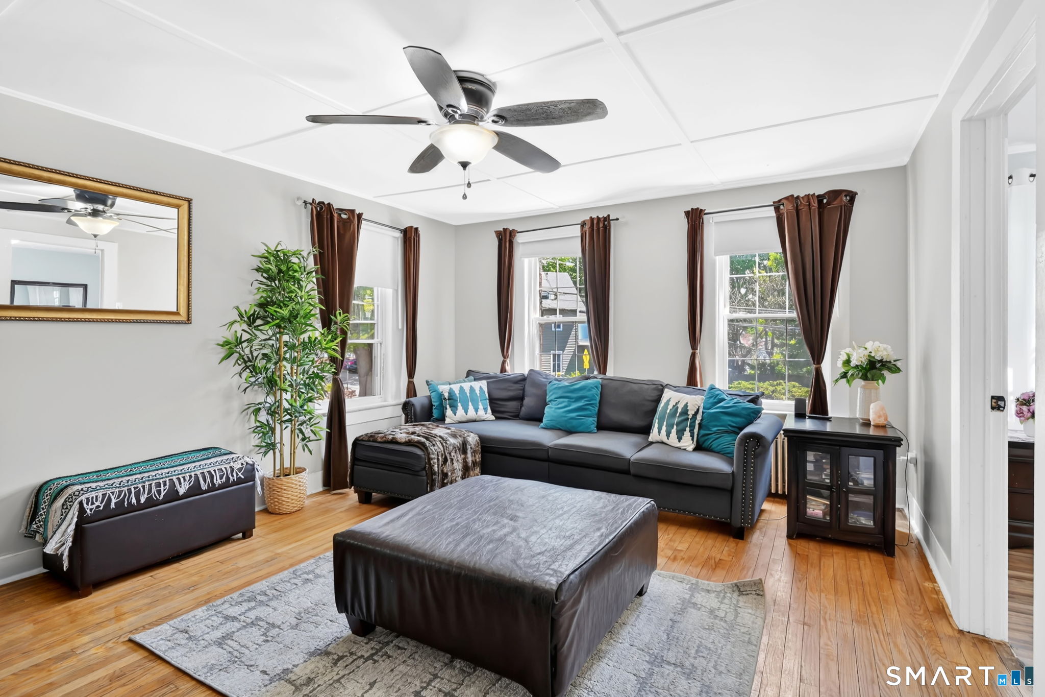 124 Prospect Street Vernon, CT 06066 - Photo 14 of 31 a living room with furniture ceiling fan and a rug