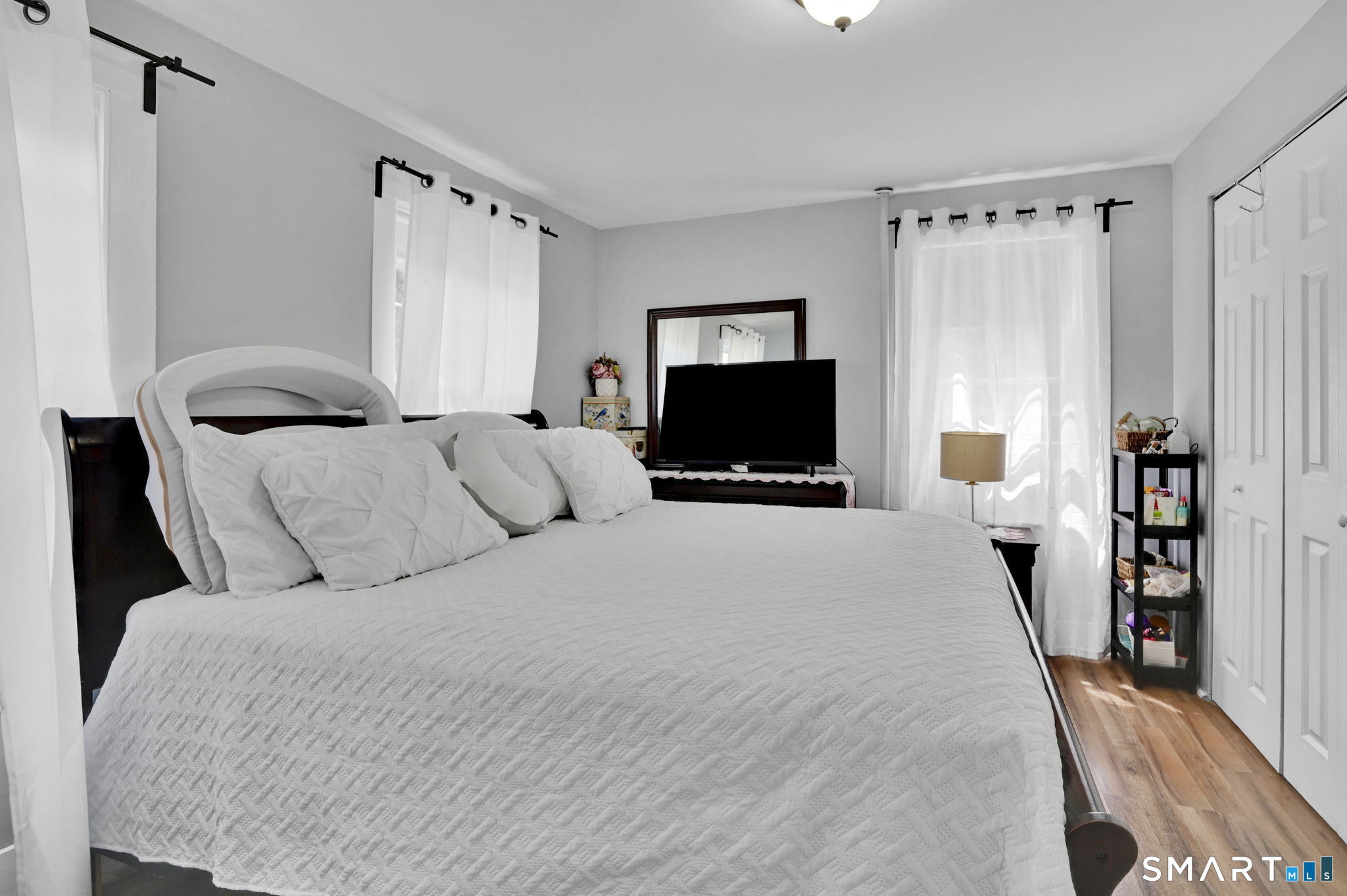 124 Prospect Street Vernon, CT 06066 - Photo 16 of 31 a bedroom with a bed and a flat tv screen