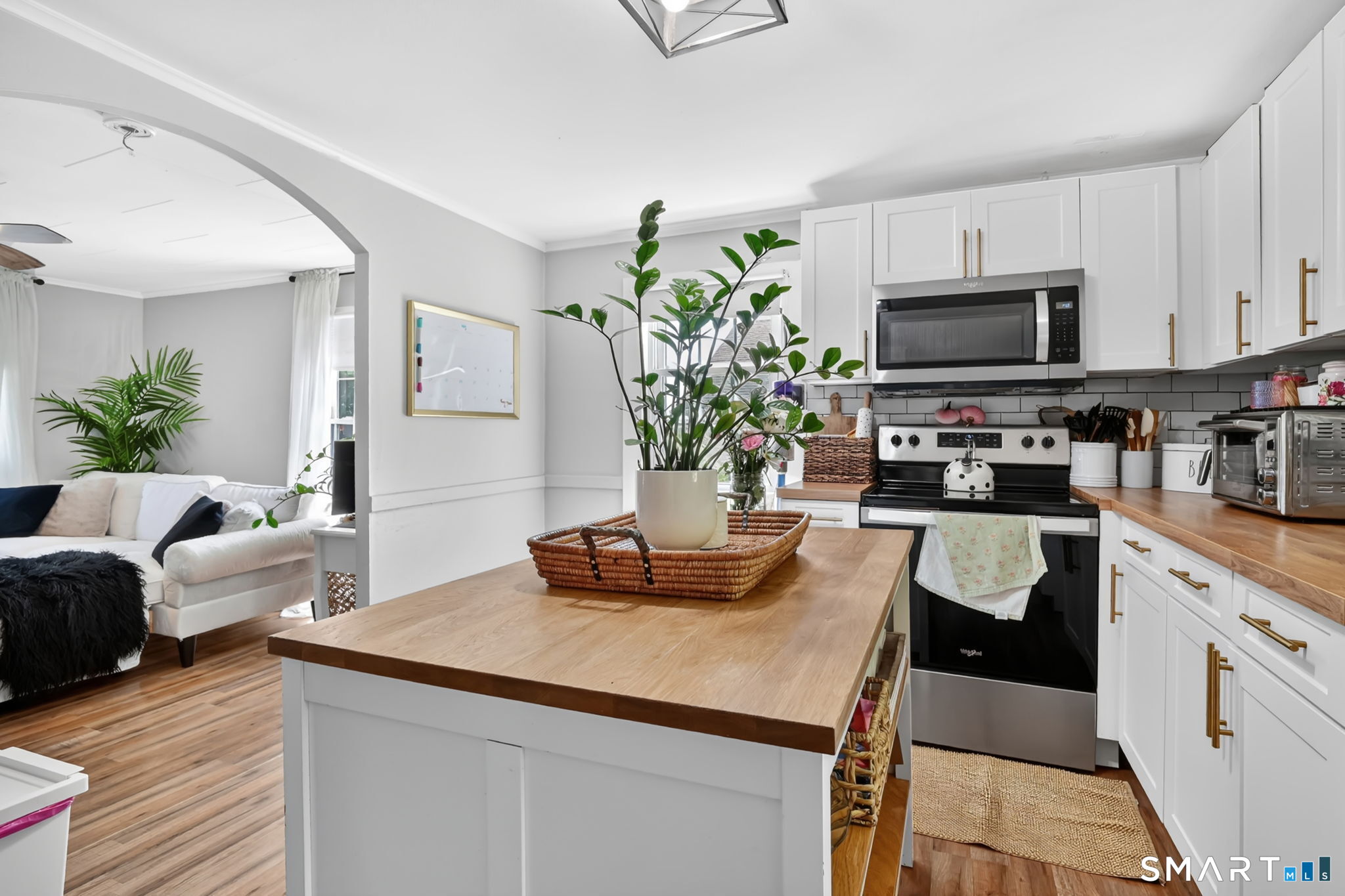 124 Prospect Street Vernon, CT 06066 - Photo 18 of 31 a kitchen with stainless steel appliances a sink a counter top space cabinets and a potted plant