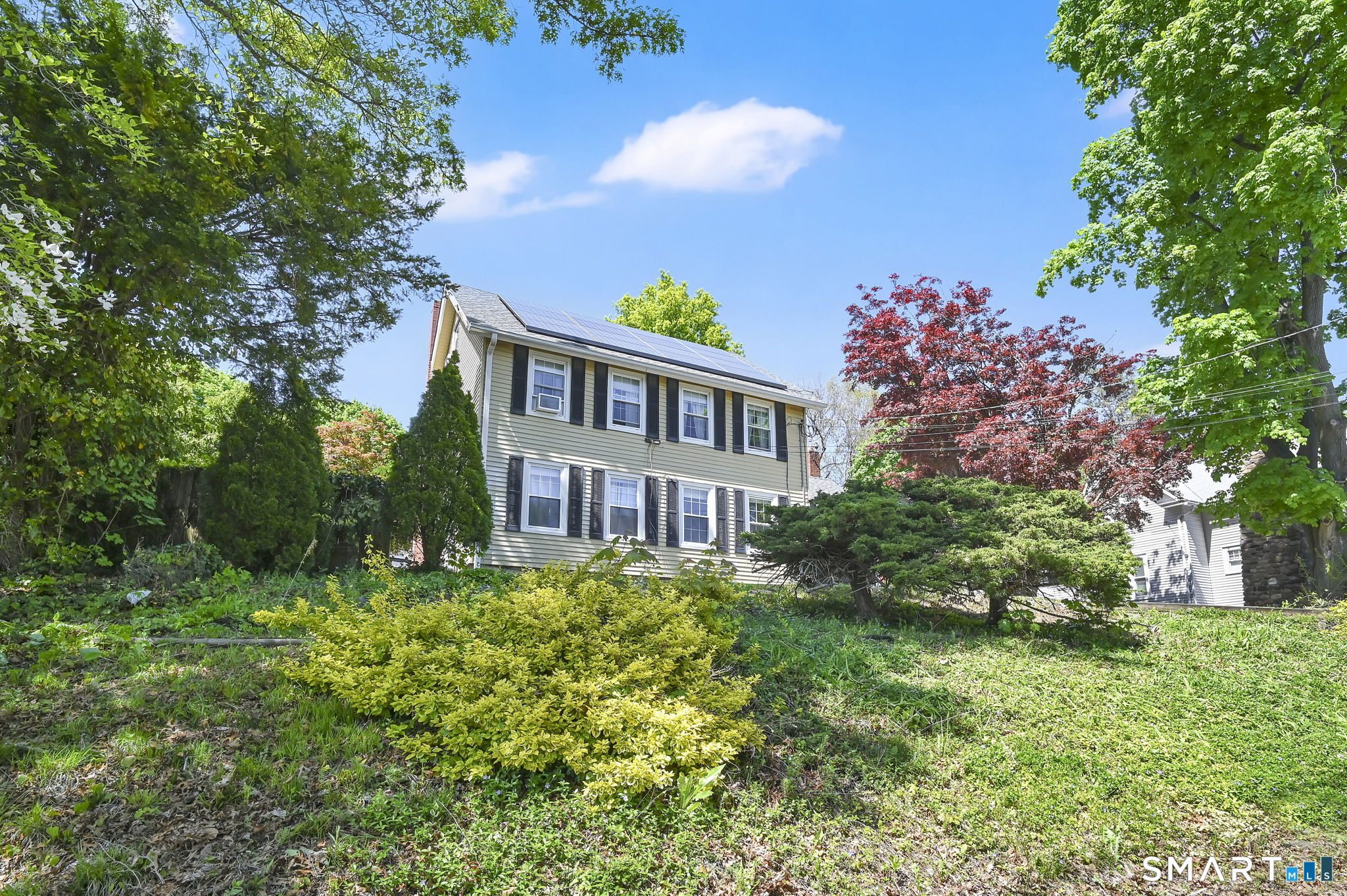 124 Prospect Street Vernon, CT 06066 - Photo 3 of 31 a view of a house with a yard and potted plants