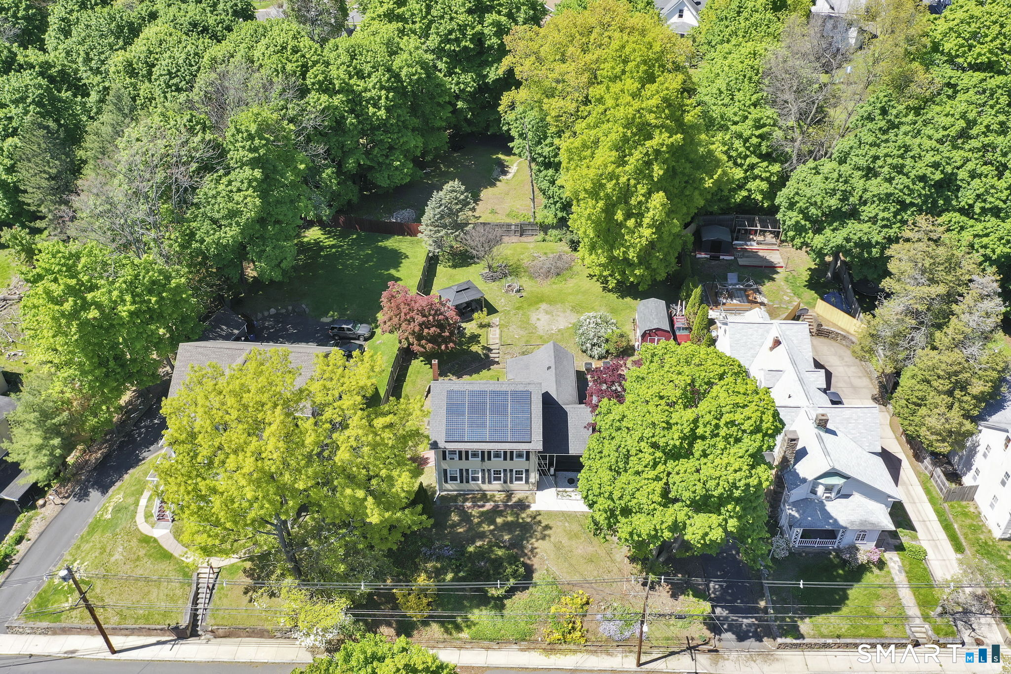 124 Prospect Street Vernon, CT 06066 - Photo 4 of 31 an aerial view of a house with a yard and garden