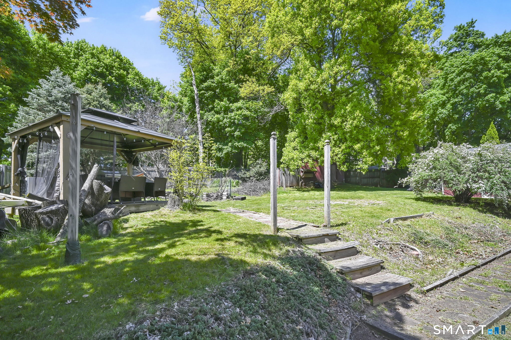 124 Prospect Street Vernon, CT 06066 - Photo 6 of 31 a view of a backyard with sitting area and slide