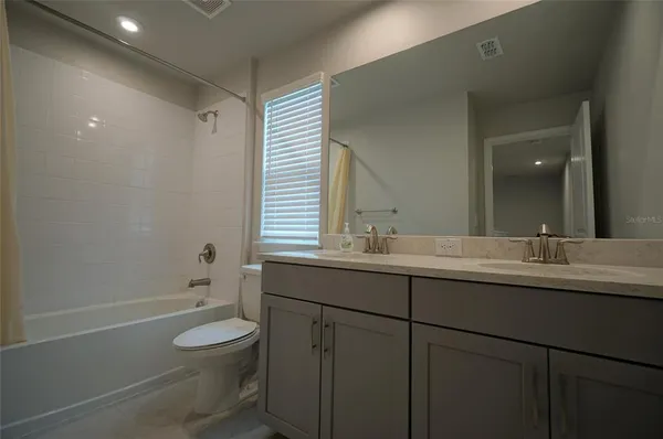 a view of a living room and floor to ceiling window