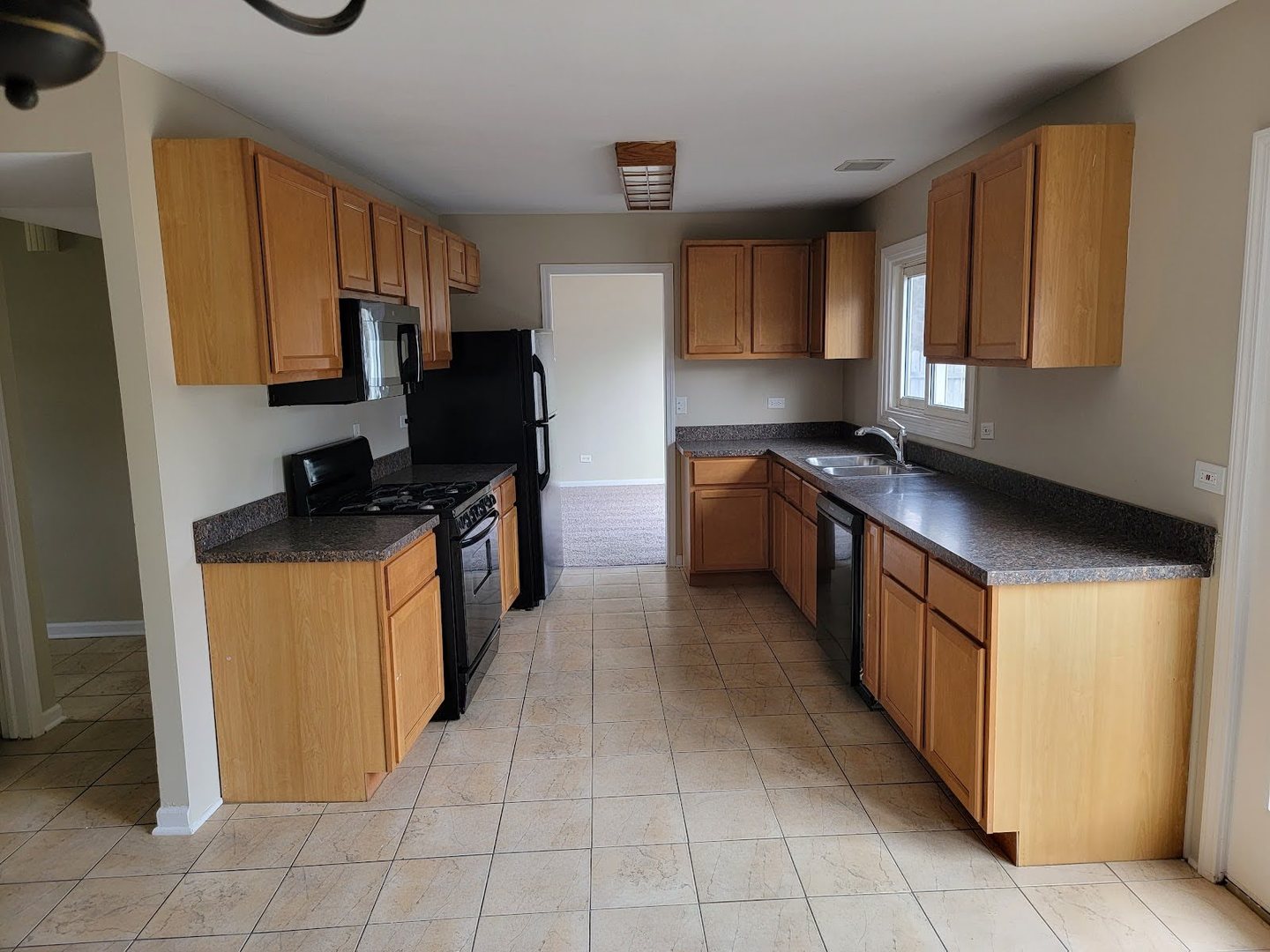 1935 Ashley Road Hoffman Estates, IL 60169 - Photo 11 of 28 a kitchen with stainless steel appliances granite countertop a stove and a refrigerator