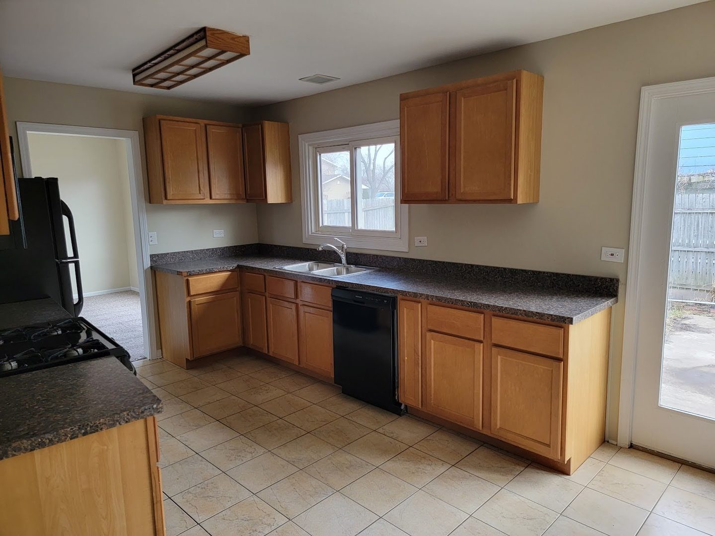 1935 Ashley Road Hoffman Estates, IL 60169 - Photo 13 of 28 a kitchen with stainless steel appliances granite countertop a sink stove and refrigerator