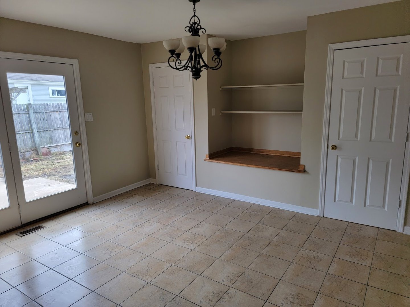 1935 Ashley Road Hoffman Estates, IL 60169 - Photo 14 of 28 an empty room with fireplace and windows