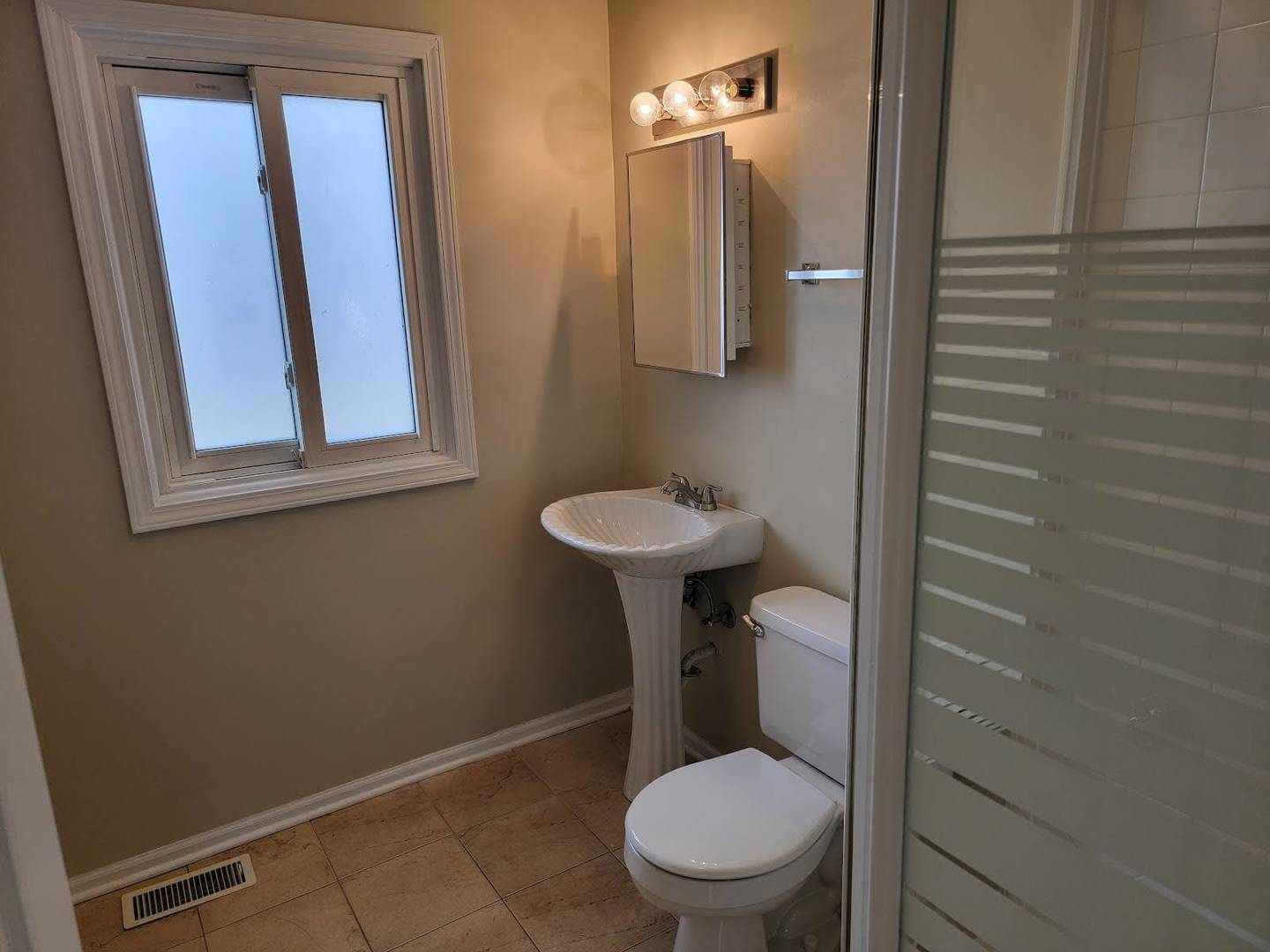1935 Ashley Road Hoffman Estates, IL 60169 - Photo 21 of 28 a bathroom with a sink toilet and a mirror