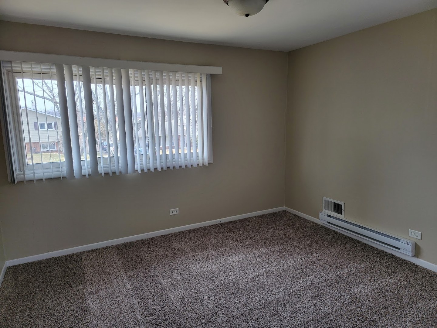 1935 Ashley Road Hoffman Estates, IL 60169 - Photo 26 of 28 an empty room with a window