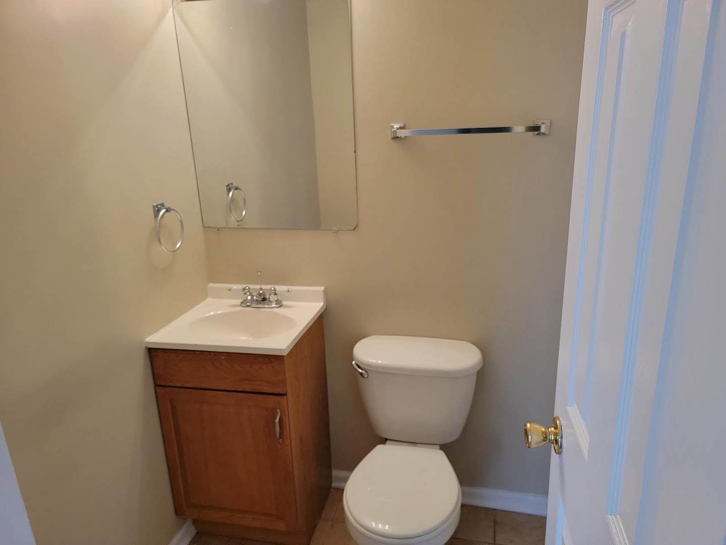 1935 Ashley Road Hoffman Estates, IL 60169 - Photo 6 of 28 a bathroom with a toilet sink and mirror