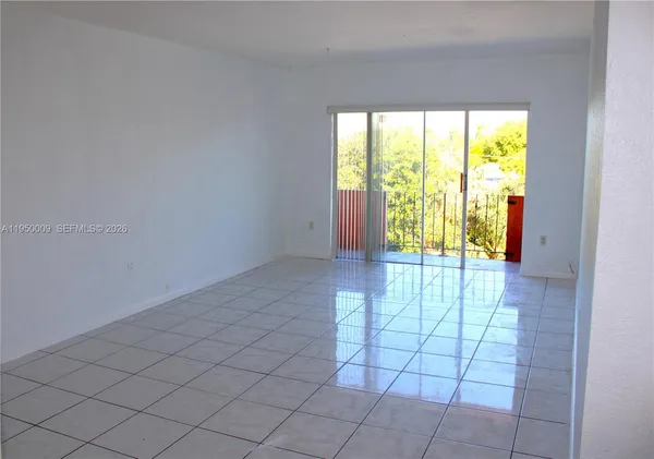 a kitchen with a stove and a refrigerator