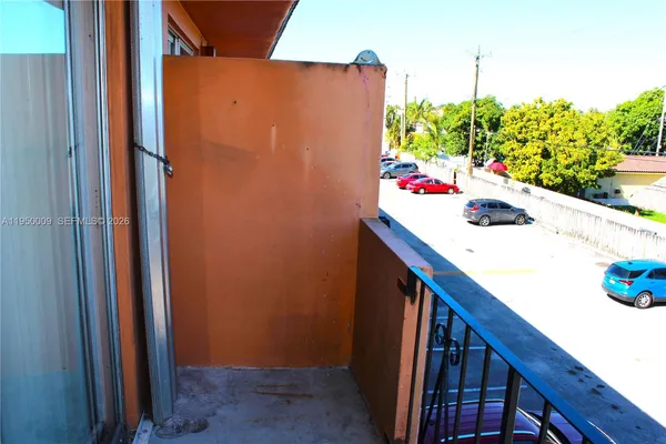 a view of balcony with furniture