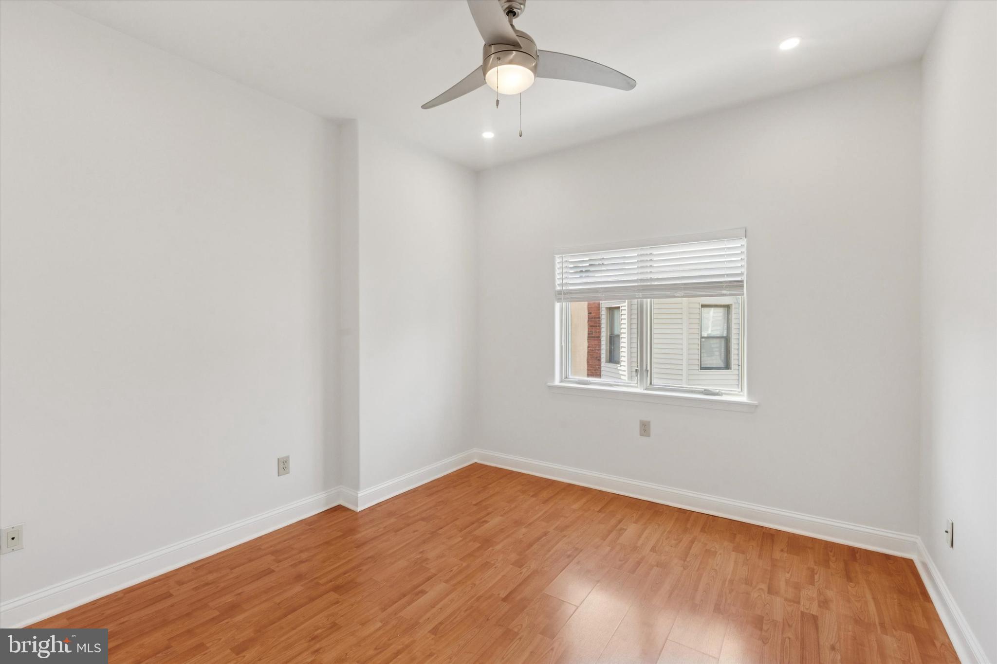 2522-24 South Broad Street, Unit 2F Philadelphia, PA 19145 - Photo 12 of 15 an empty room with a window and ceiling fan