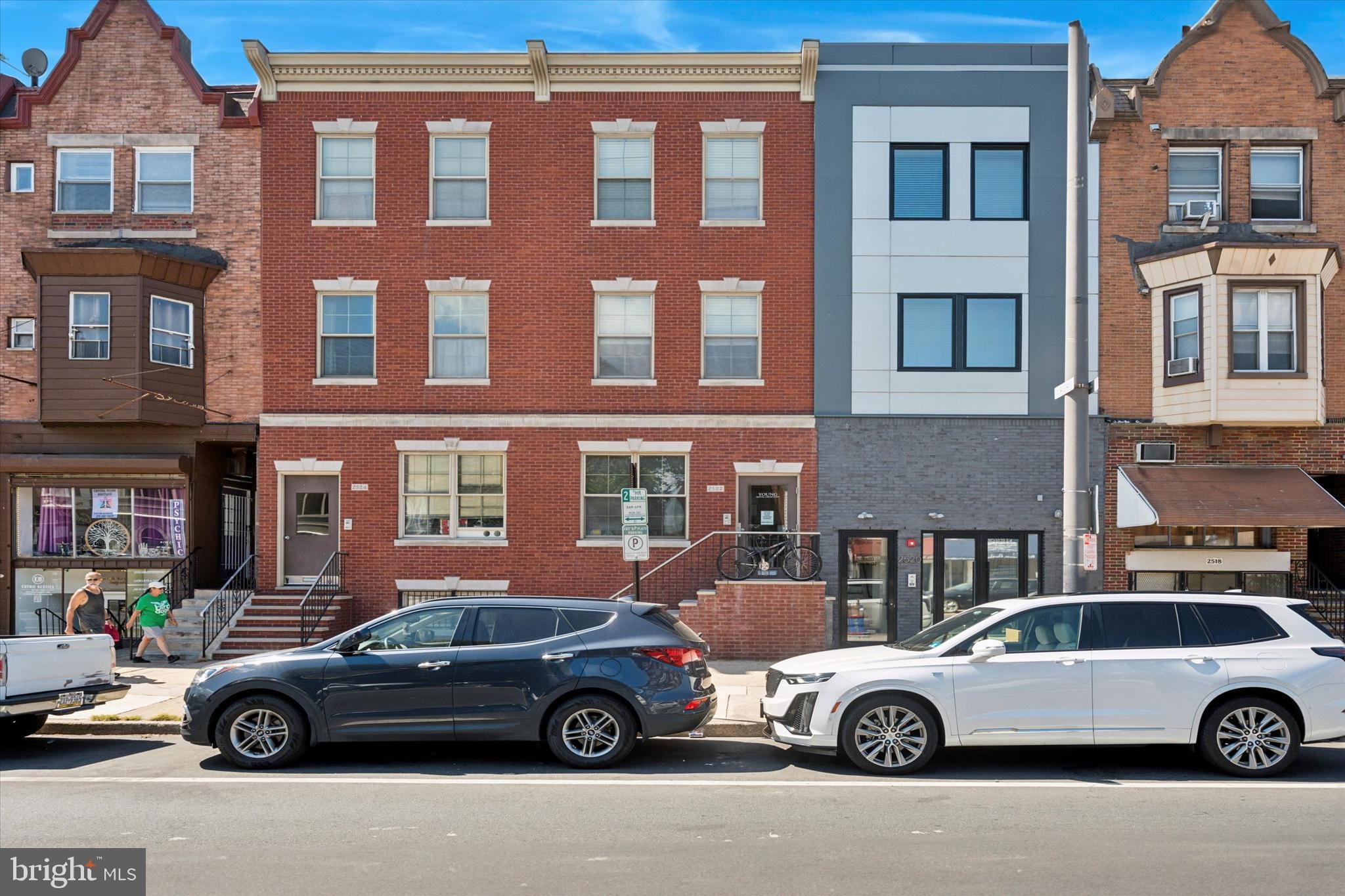 2522-24 South Broad Street, Unit 2F Philadelphia, PA 19145 - Photo 15 of 15 a front view of a house with parking space