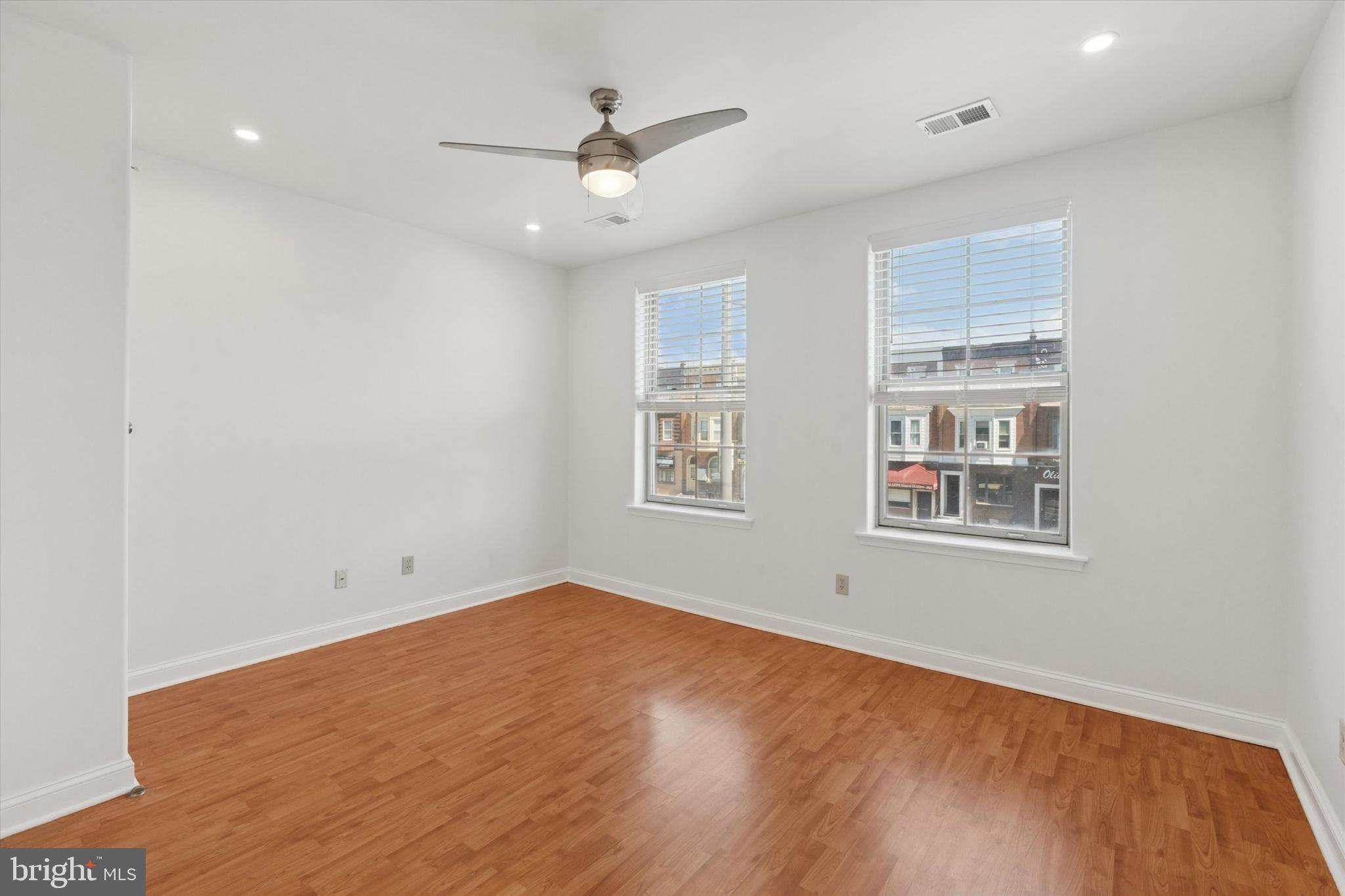 2522-24 South Broad Street, Unit 2F Philadelphia, PA 19145 - Photo 6 of 15 wooden floor in an empty room with a window