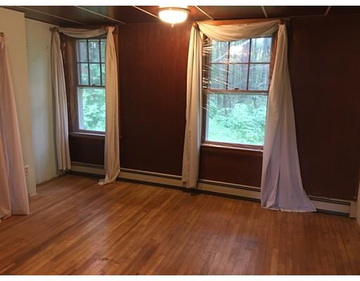 186 Flat Rock Road Athol, MA 01331 - Photo 11 of 13 an empty room with wooden floor and windows