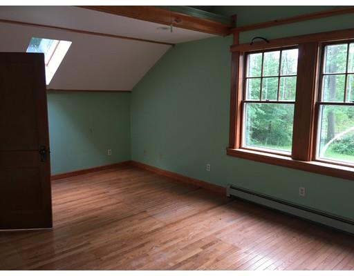 186 Flat Rock Road Athol, MA 01331 - Photo 13 of 13 an empty room with wooden floor and windows