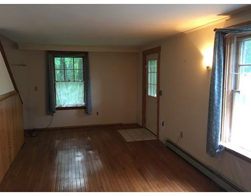 186 Flat Rock Road Athol, MA 01331 - Photo 5 of 13 an empty room with wooden floor and windows