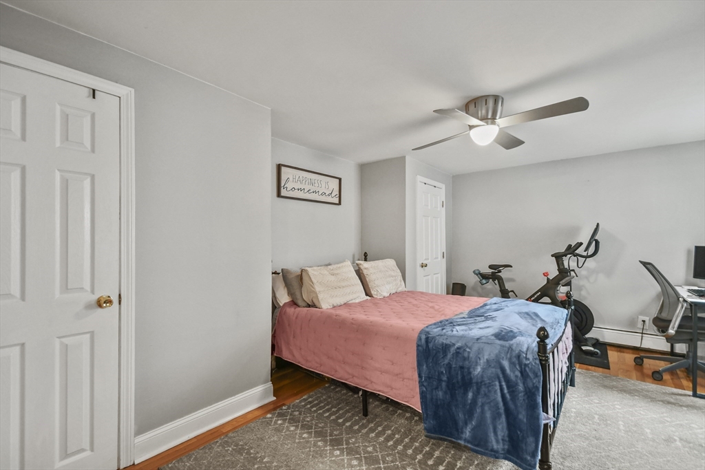 9 Allston Street, Unit 1 Boston, MA 02129 - Photo 12 of 19 a bedroom with a bed and a chandelier