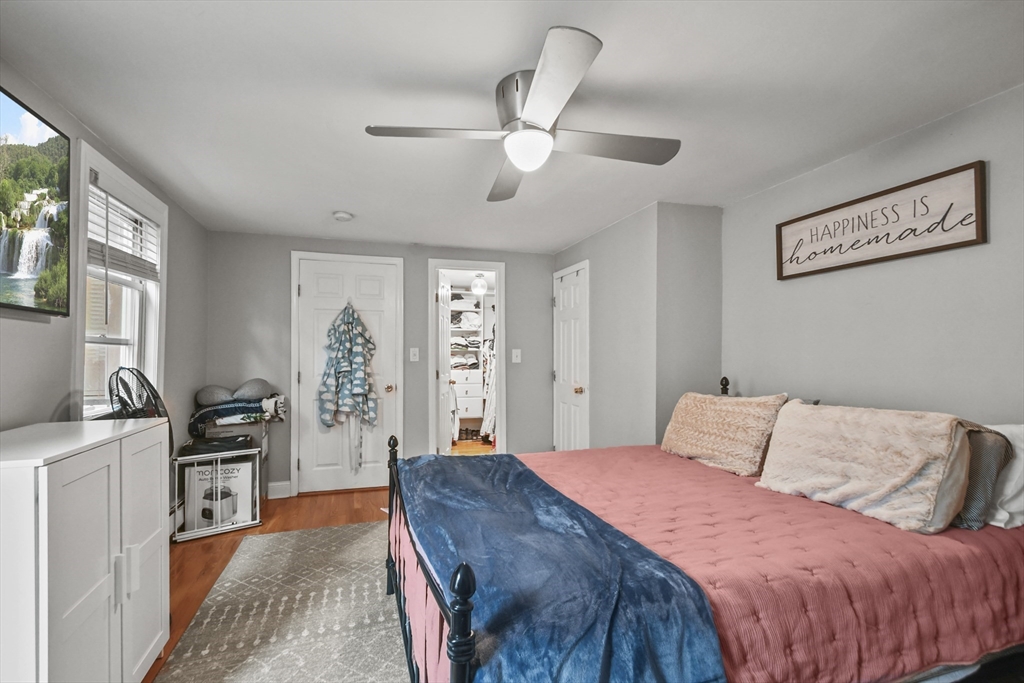 9 Allston Street, Unit 1 Boston, MA 02129 - Photo 13 of 19 a bedroom with a bed and wooden floor