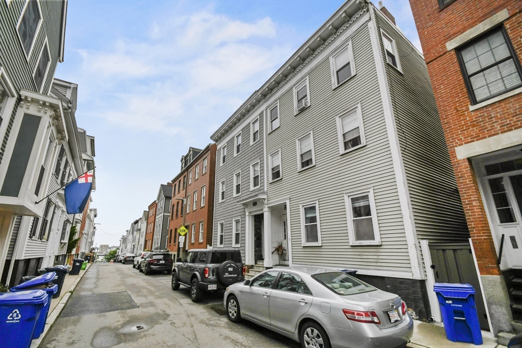 9 Allston Street, Unit 1 Boston, MA 02129 - Photo 19 of 19 a car parked in front of a building