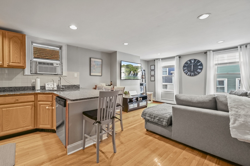 9 Allston Street, Unit 1 Boston, MA 02129 - Photo 2 of 19 a living room with furniture and a large window