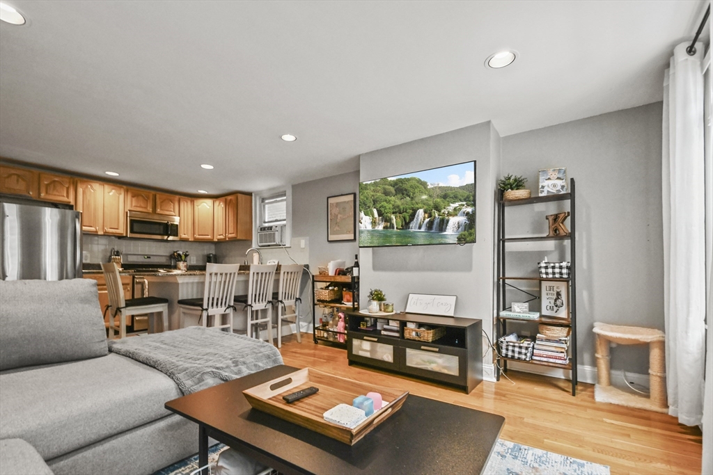 9 Allston Street, Unit 1 Boston, MA 02129 - Photo 4 of 19 a living room with furniture and a wooden floor