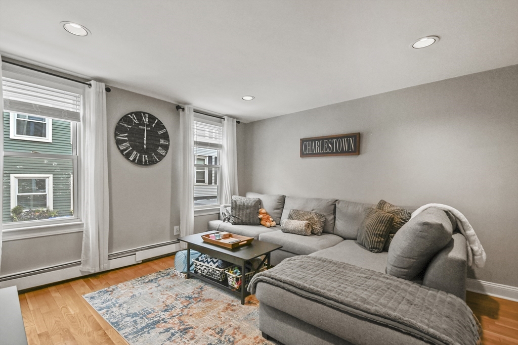 9 Allston Street, Unit 1 Boston, MA 02129 - Photo 5 of 19 a living room with furniture and wooden floor